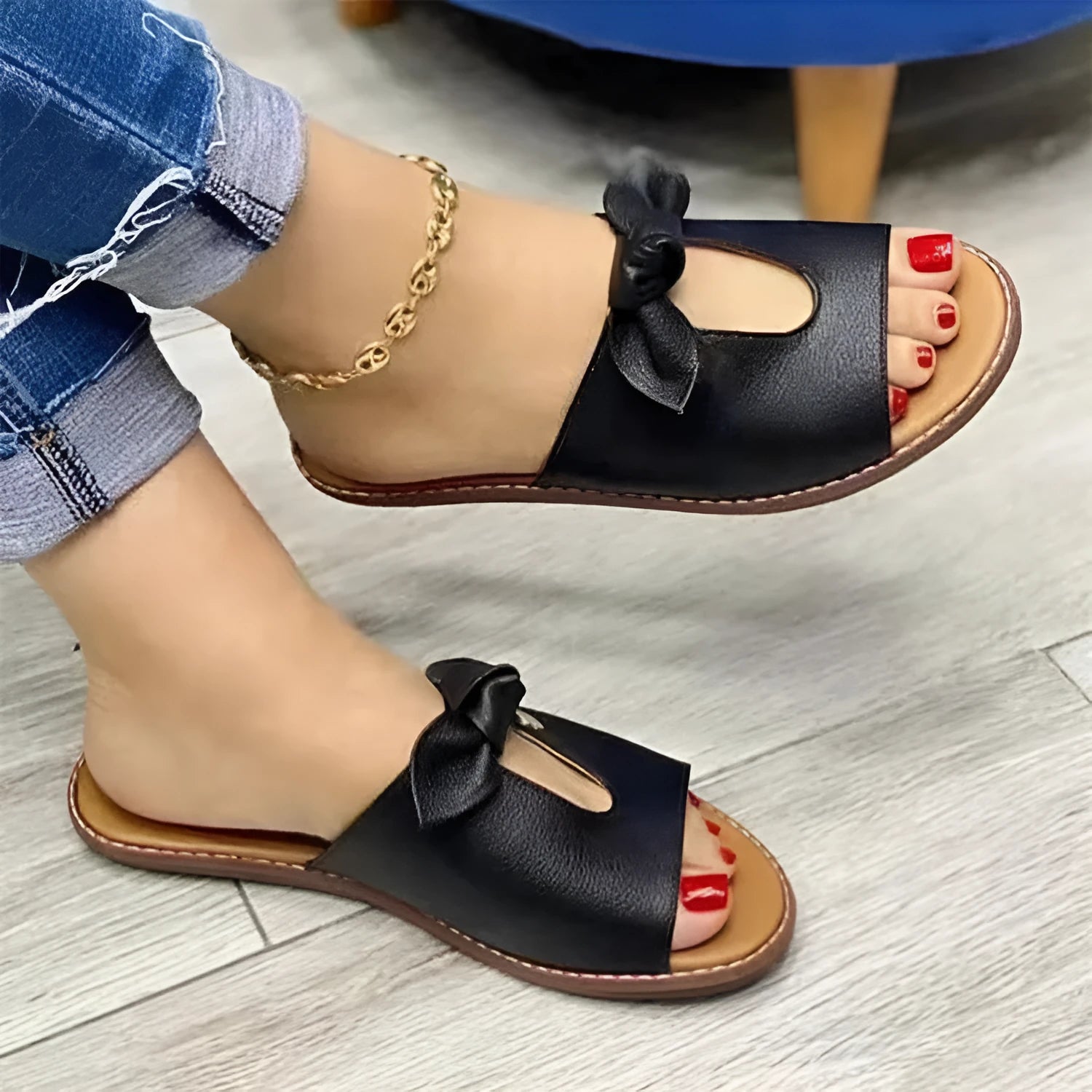Ladies black fish mouth slippers with a bow decoration on the artificial PU upper