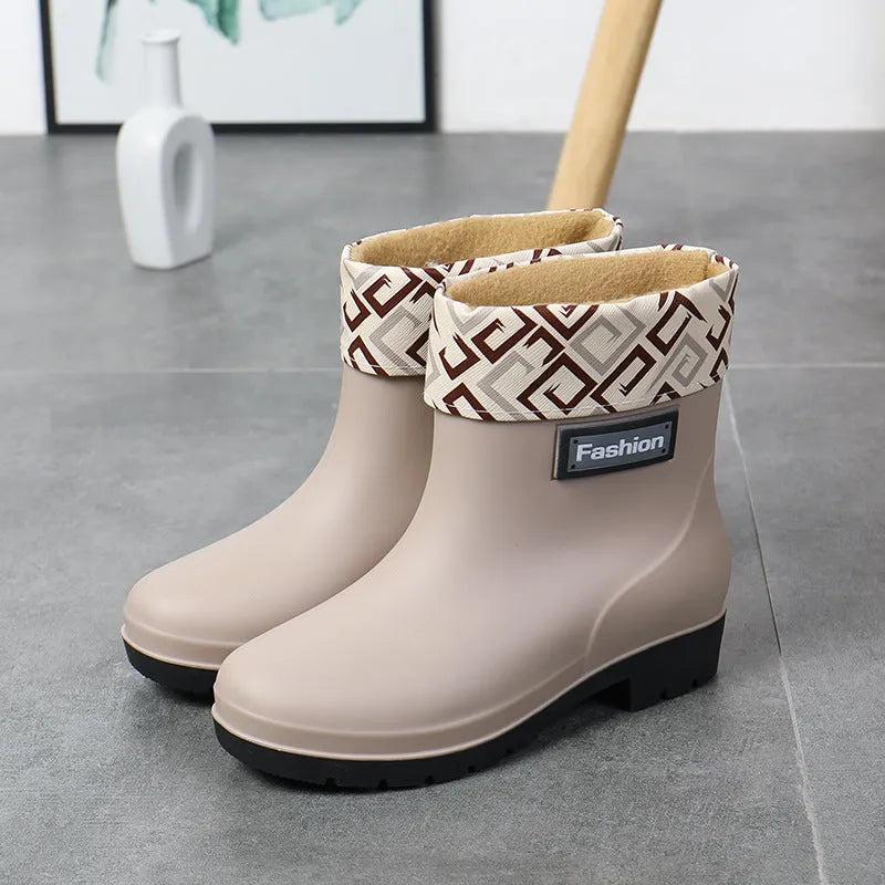 Women's mid-calf rain boot in black PVC with a low heel, shown alongside apricot and brown colour options.