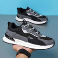 Men's colour block mesh sneakers in grey with lace-up front and low-top design.