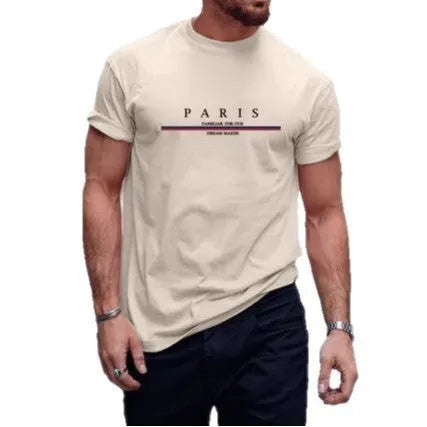 Man wearing a loose fit pure cotton t-shirt with a printed letter design on the front in apricot colour.