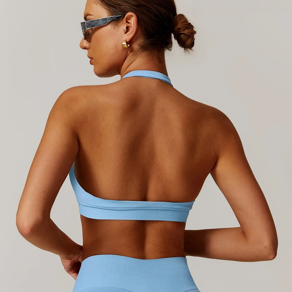 Women's halter neck yoga sports bra with removable pads in plum purple colour