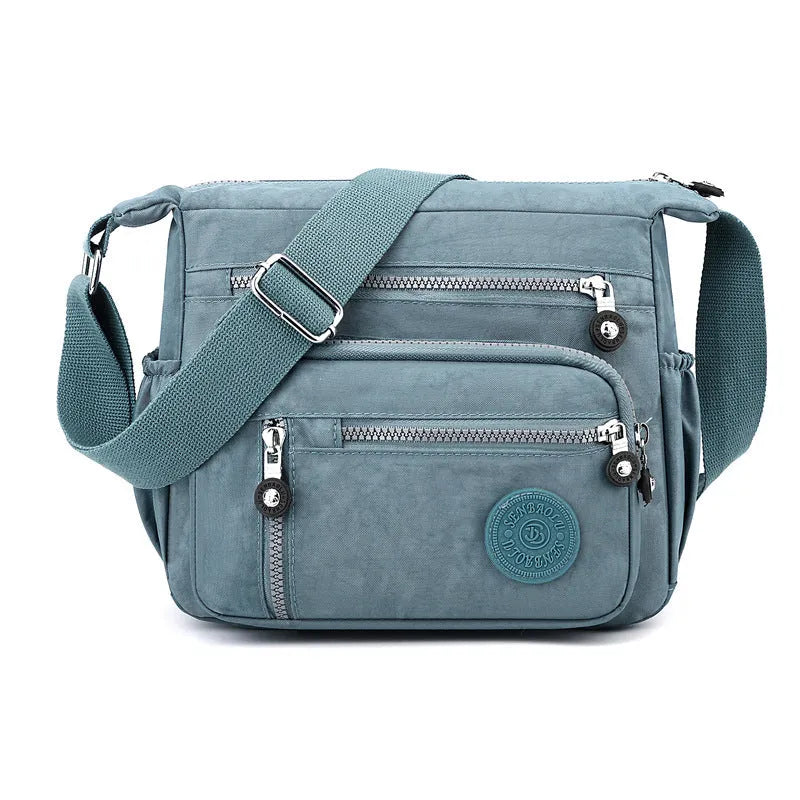 Nylon messenger bag with single shoulder strap in square vertical shape