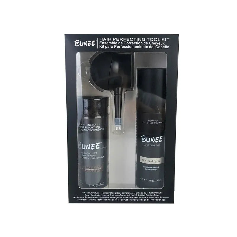 Canister of hair thickening fibre powder with nozzle and bottle of styling spray for thinning hair