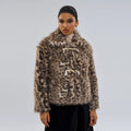 Women's leopard print street fashion coat with a buckle detail on the lapel.