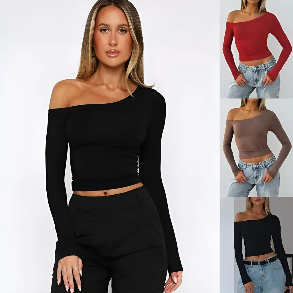 Women's slim fit knitted cardigan in a soft fabric with cross shoulder strap detail.