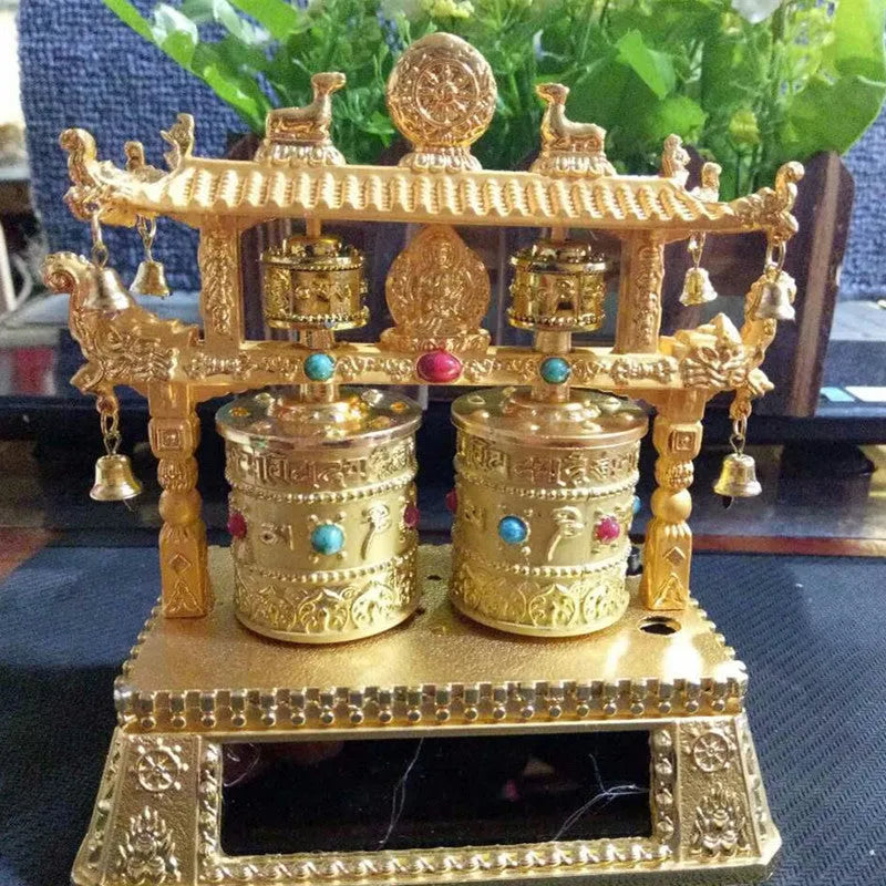 Traditional Chinese alloy prayer wheel car decoration measuring 12x15x8cm with rotating mechanism