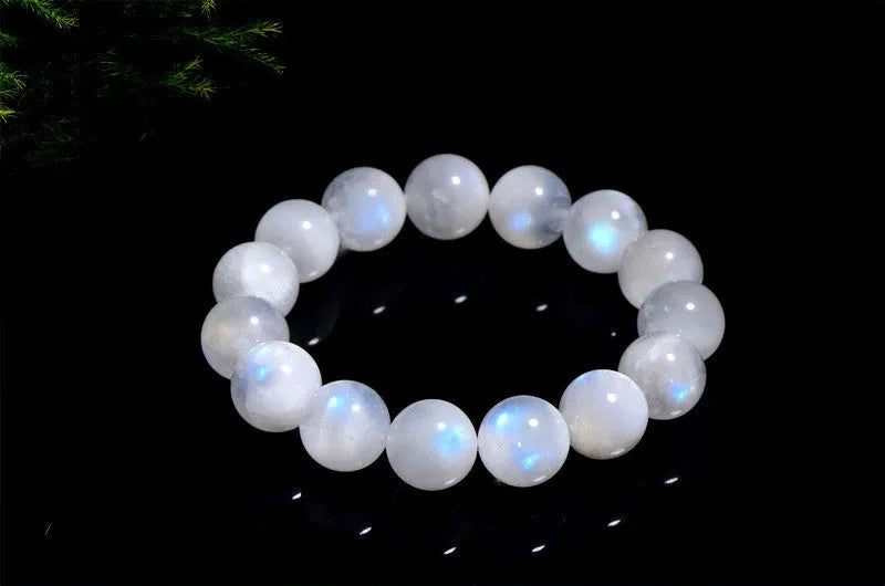 Natural blue moonlight moonstone round bead bracelet on wrist showing geometric arrangement