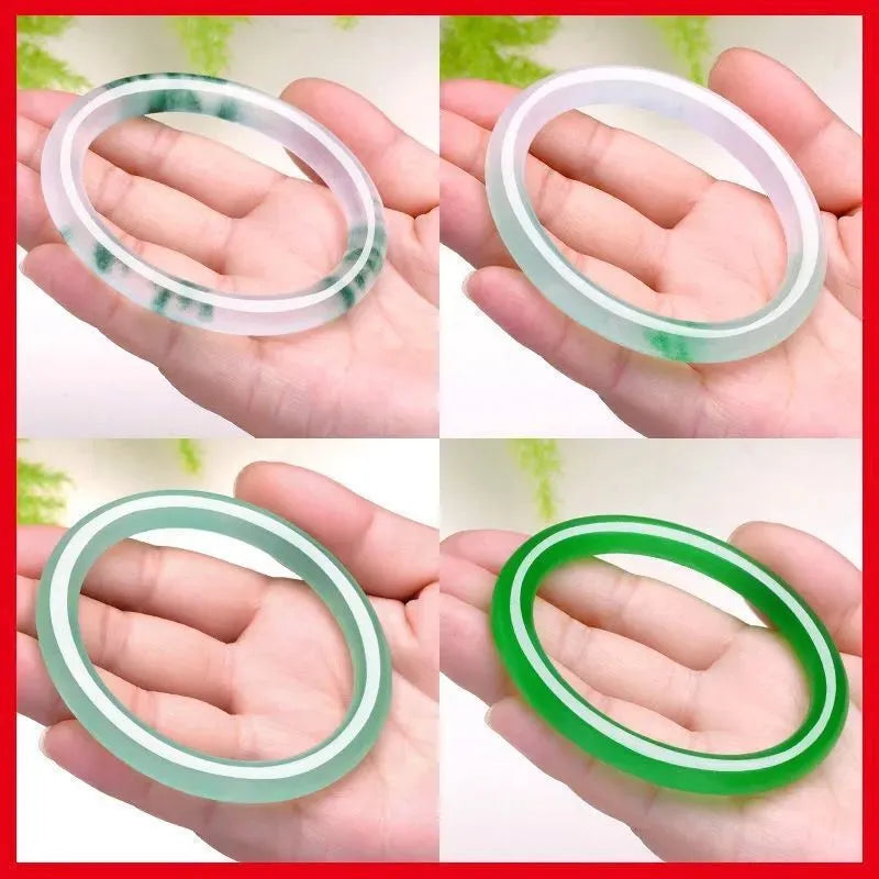 Jade bracelet with floating flower design and auspicious cloud patterns in green colour variation