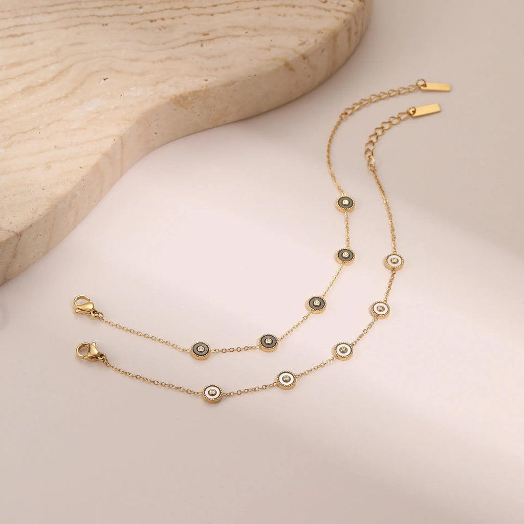 Women's stainless steel bracelet and necklace set with electroplated 18K gold finish in geometric design