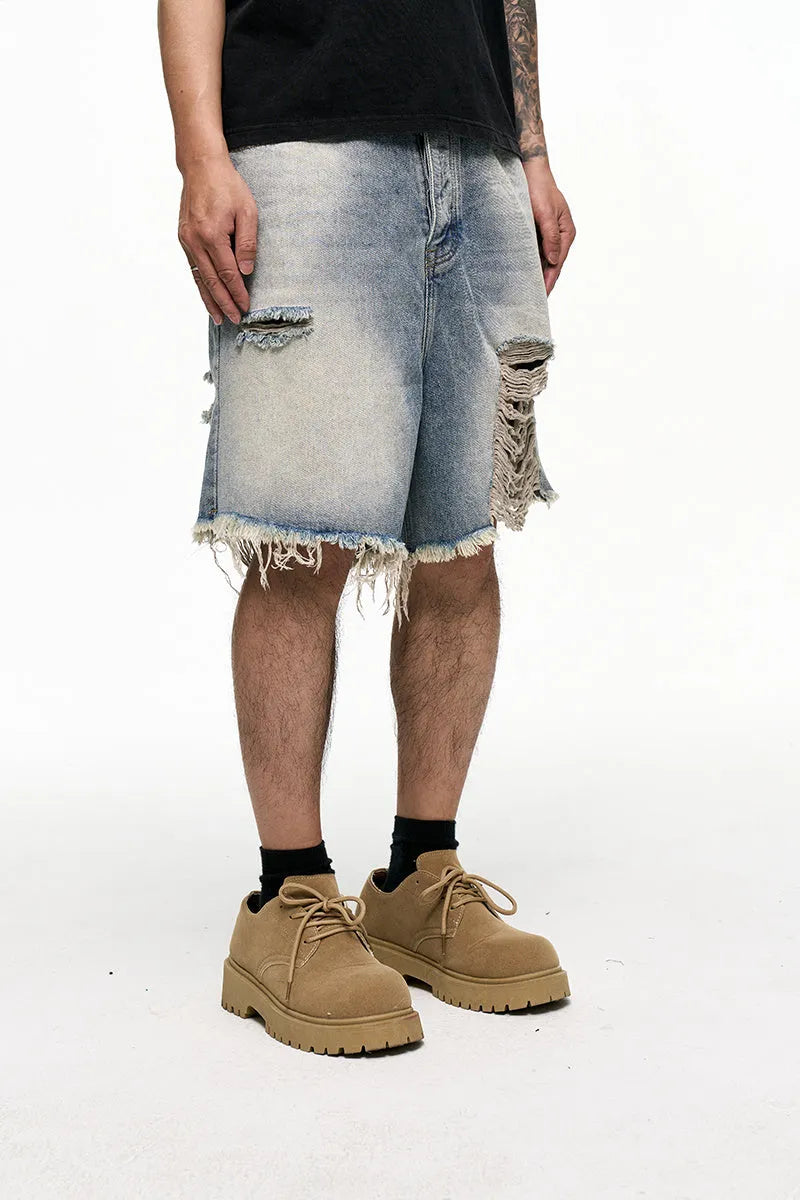 Men's light blue baggy denim shorts with wide legs and retro washed colour.