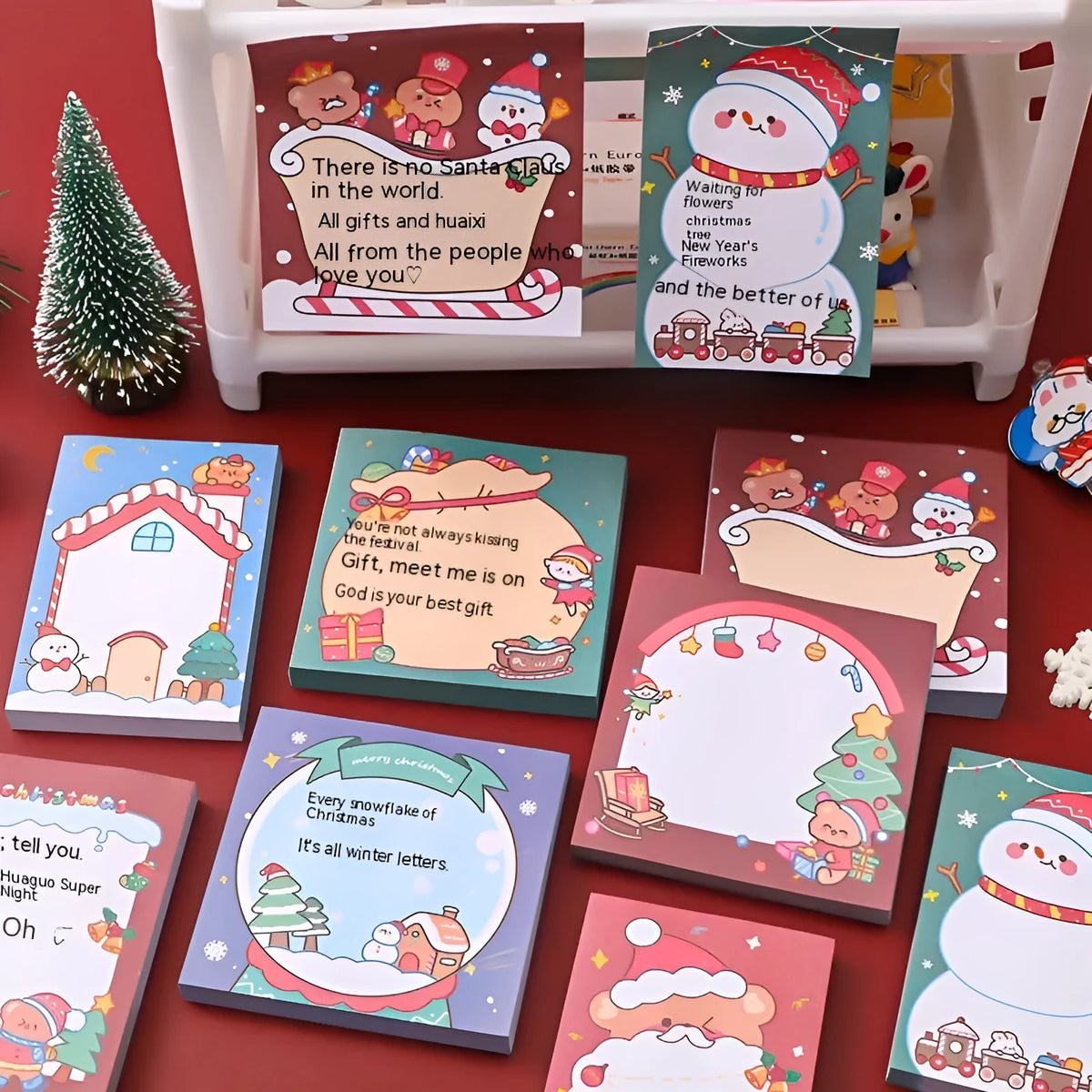 Christmas cartoon sticky notes showing elf, Santa, gift, sled, ball, house, bear, and snowman designs