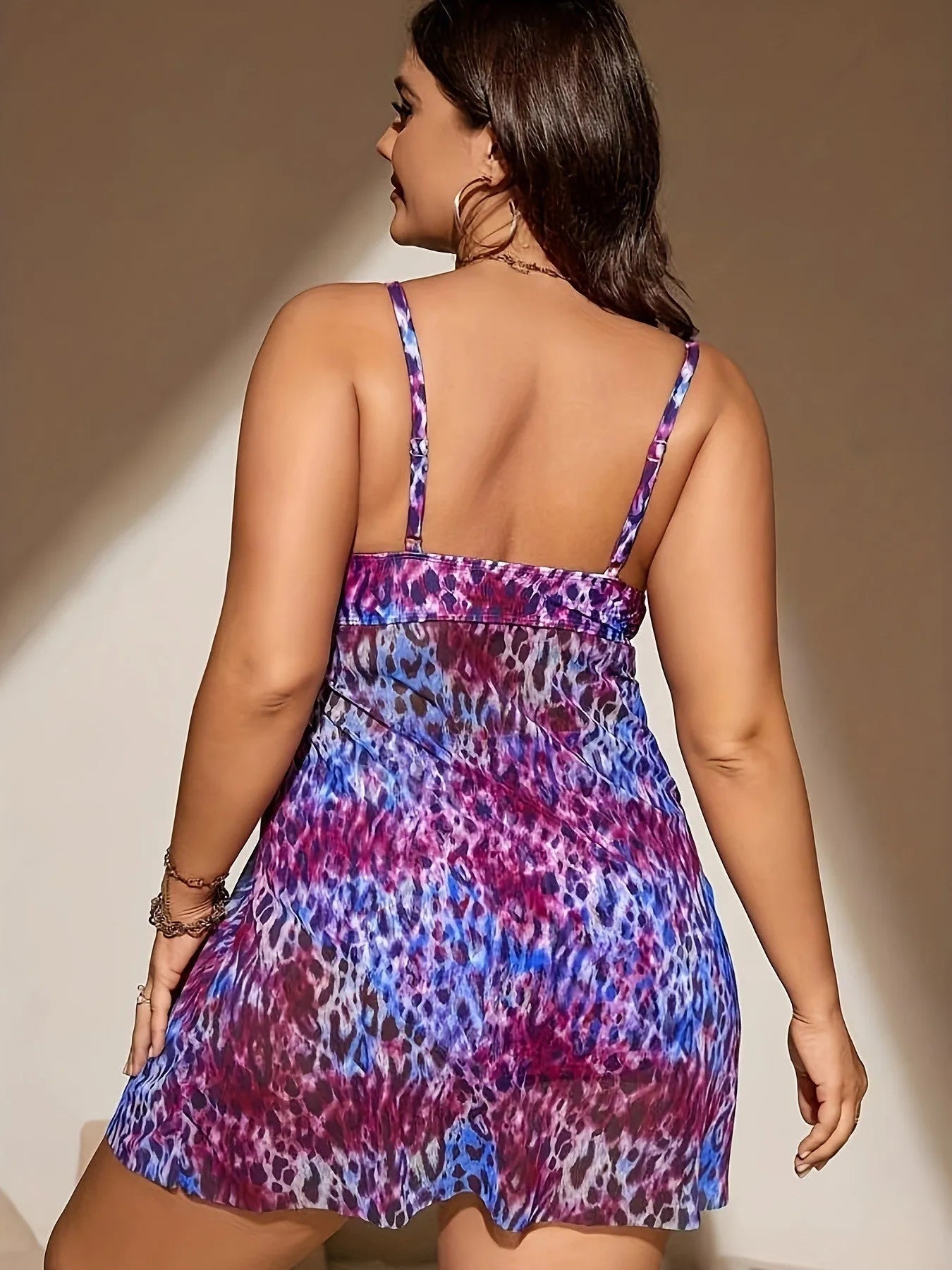Plus size red skirt bikini set on a mannequin, showing sleeveless top and split skirt bottom design.