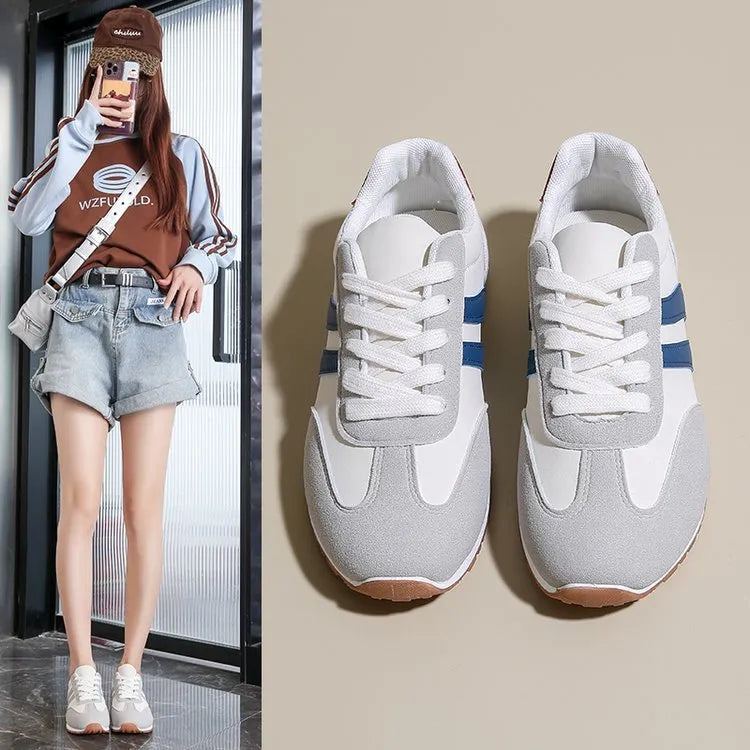 Blue and grey leisure sports shoes with Cortez stripes, flat rubber sole, and round toe.