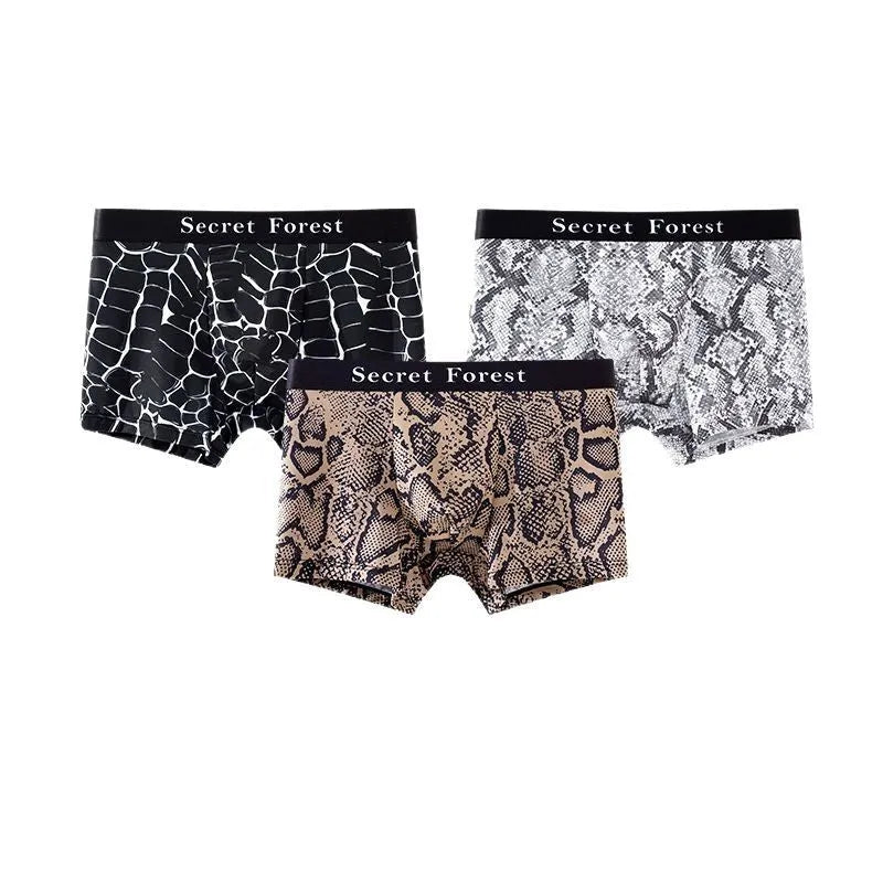 Men's thin loose polyester boxer shorts in black, grey, and brown colours on a mid-waist model.
