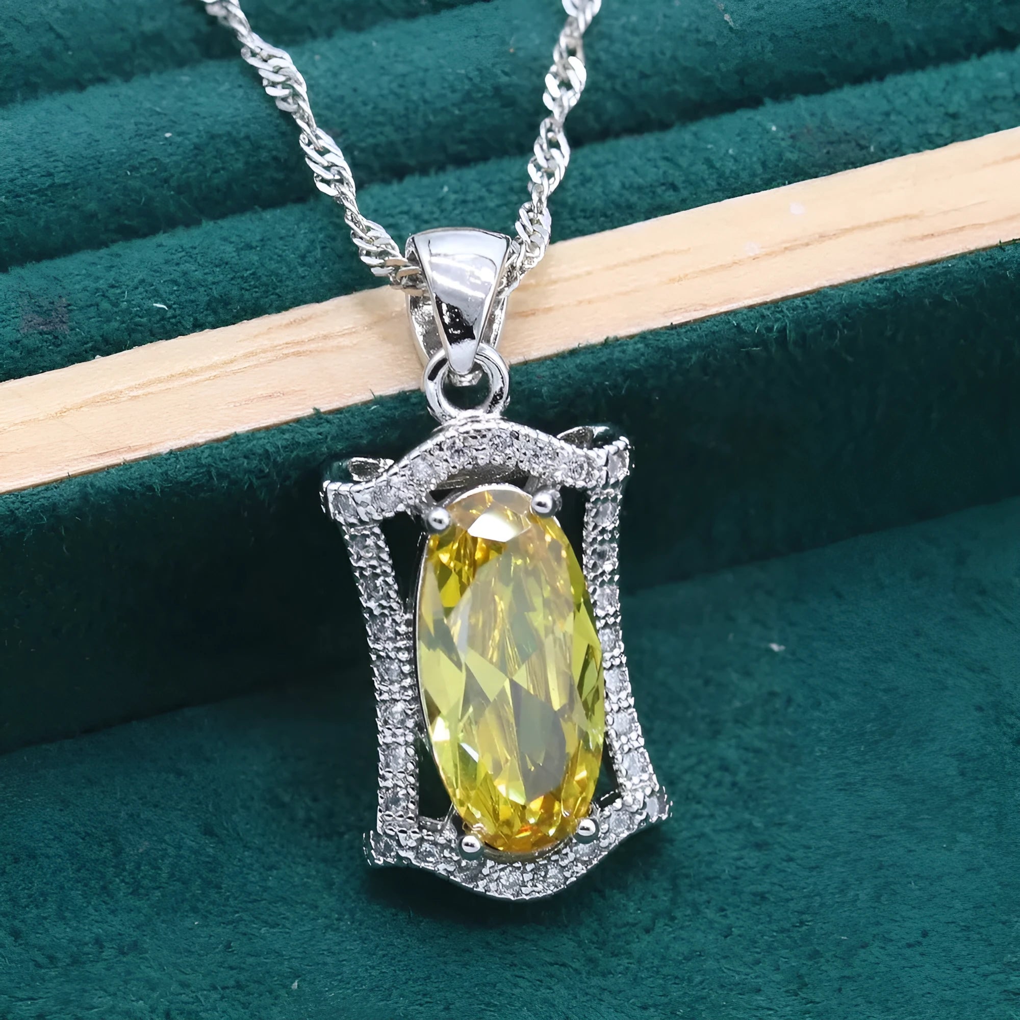 Complete zircon jewellery set with snake bone chain necklace, matching earrings, ring and bracelet in yellow or olive colour