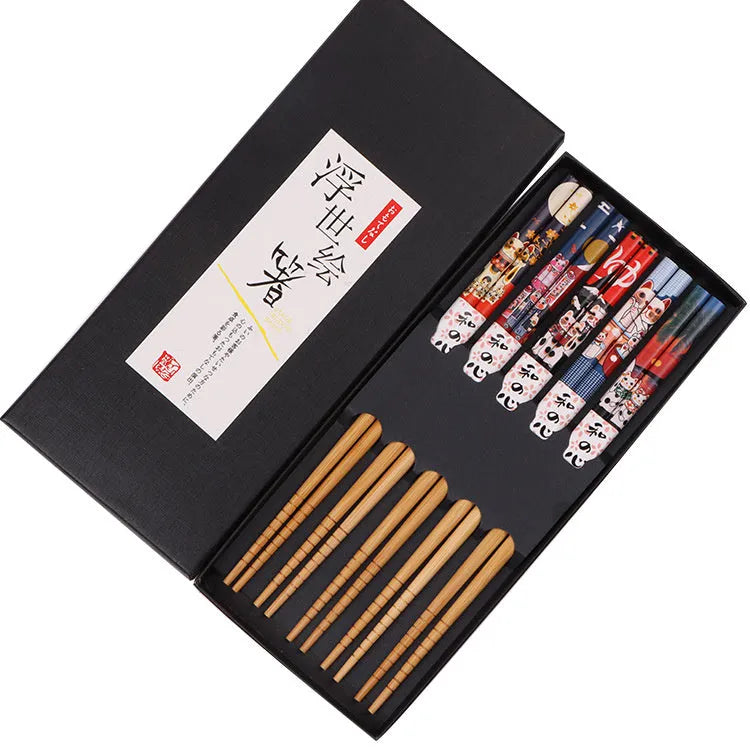 Set of five pairs of bamboo chopsticks with Japanese lucky cat pattern in a gift box.