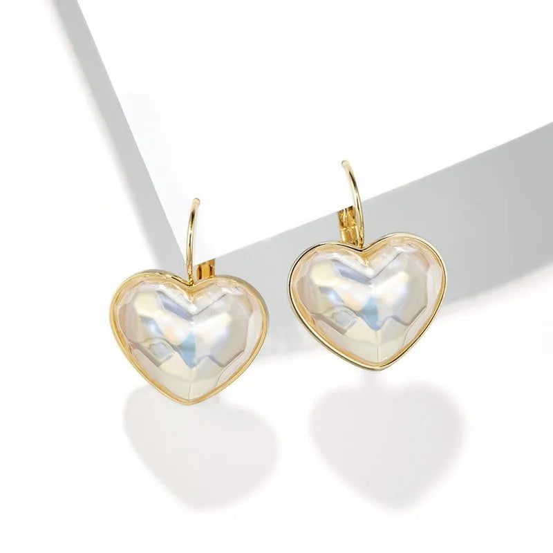 A pair of gold-coloured alloy clip-on earrings for women with a natural style.