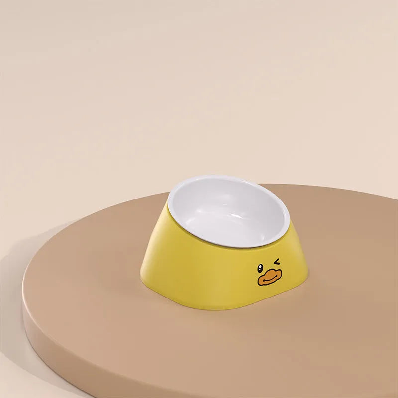 Green tilted stainless steel cat bowl with non-slip white base at a 15 degree angle