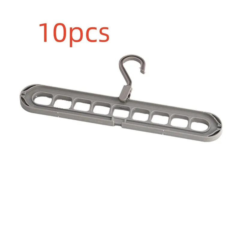 Green plastic nine-hole folding hanger for trousers shown open and folded.
