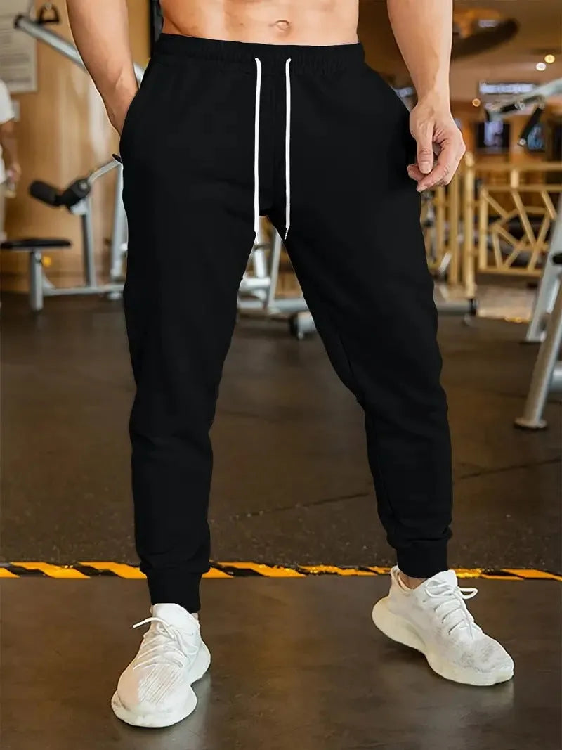 Men's linen leisure trousers with elastic drawstring waist in thin polyester fabric, loose fit design