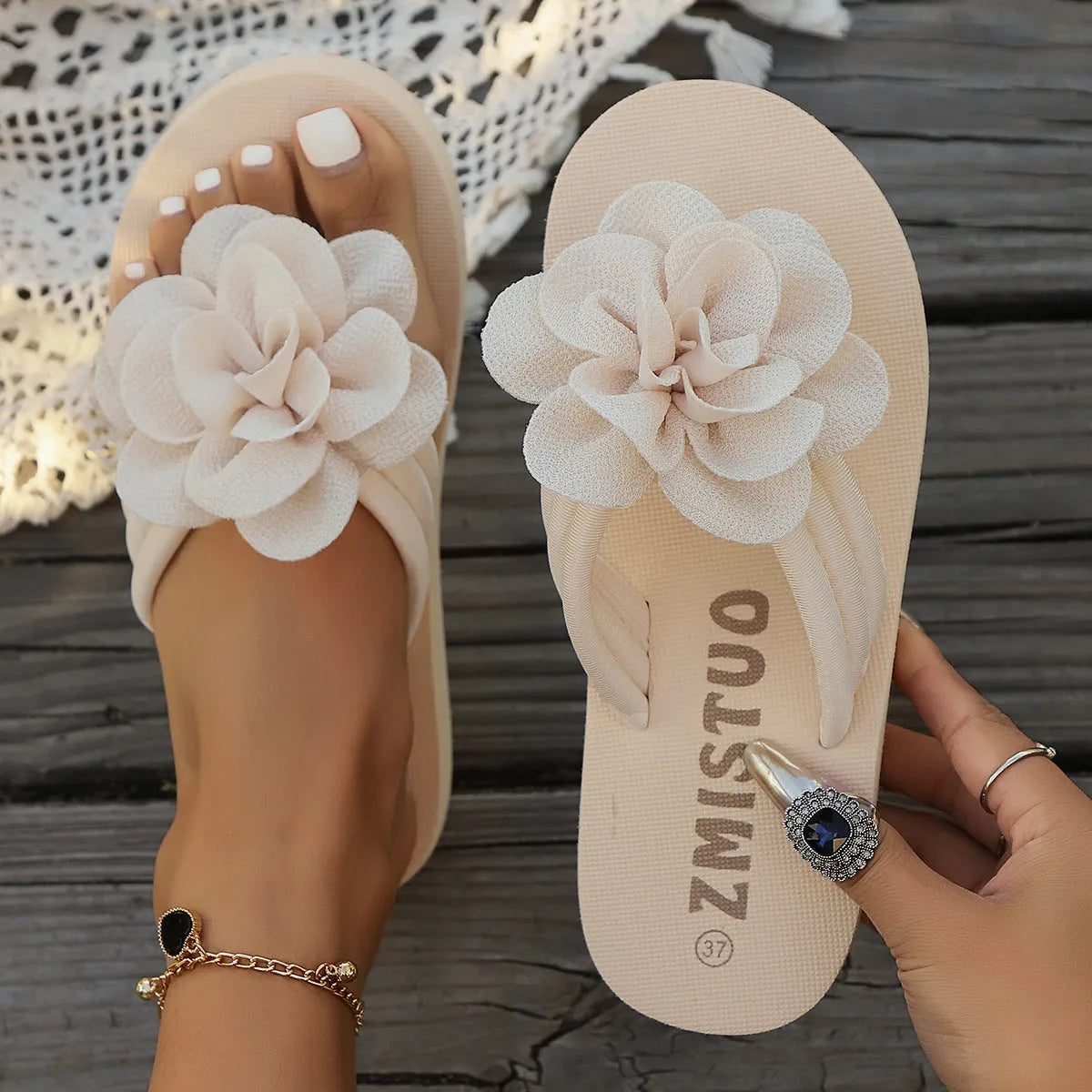 Plus size women's floral patterned PU flip flops in green, shown in a size 39.