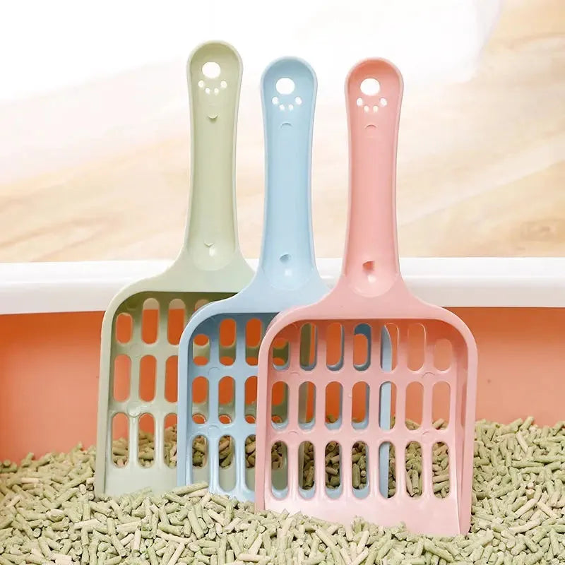 Blue plastic cat litter scoop with slotted design measuring 20cm long for litter box cleaning