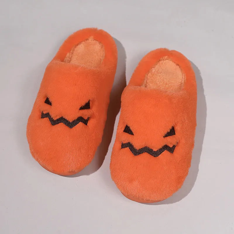 Orange Halloween pumpkin design plush slippers with coral velvet upper and non-slip sole.