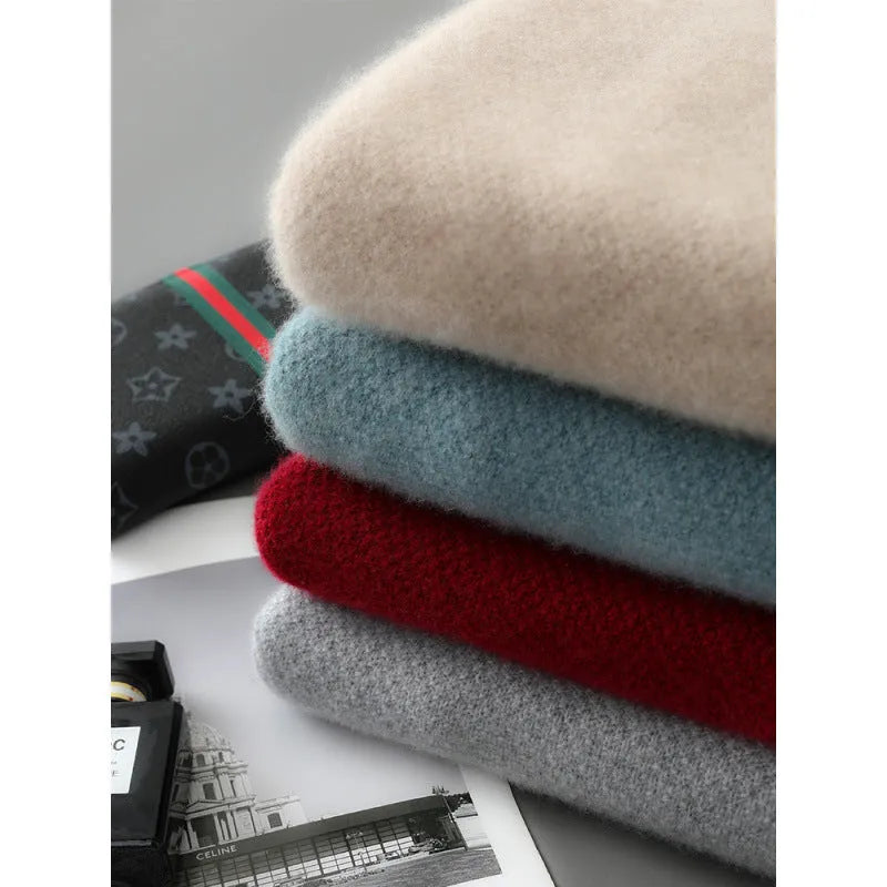 Slim fit grey sheep wool knitted sweater with a half-height zip and round neck on a hanger.