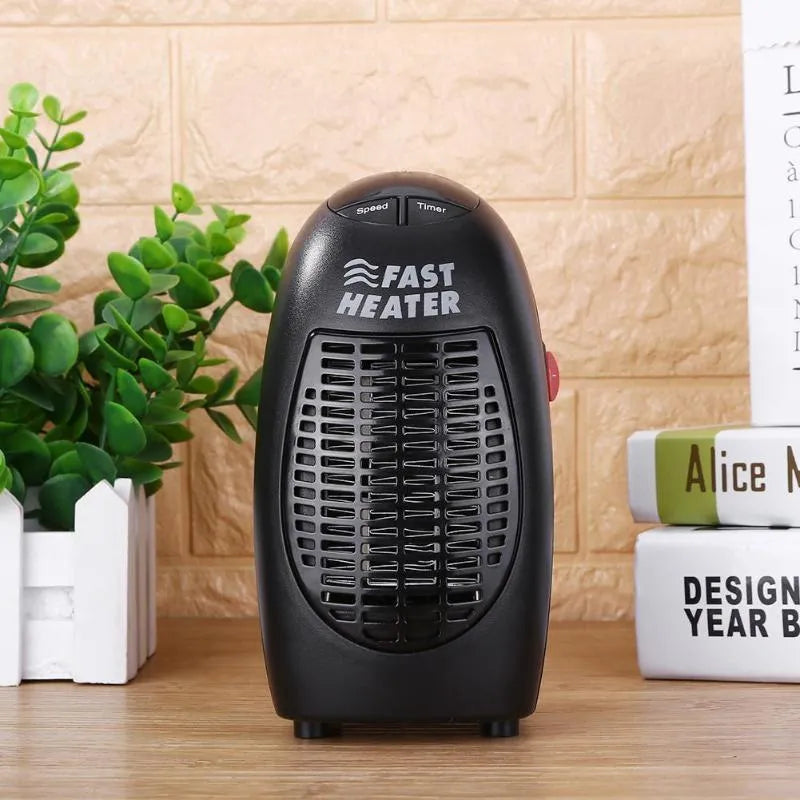 Small black mini ceramic electric heater with digital display and a rotating three-prong plug.