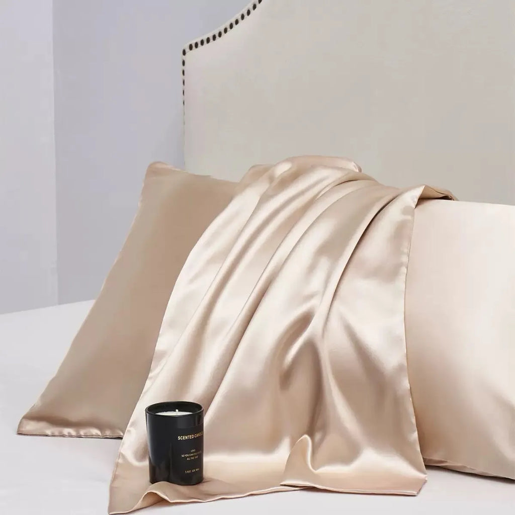 A pair of solid colour satin pillowcases in a chosen colour, showing smooth texture and plain weave fabric.
