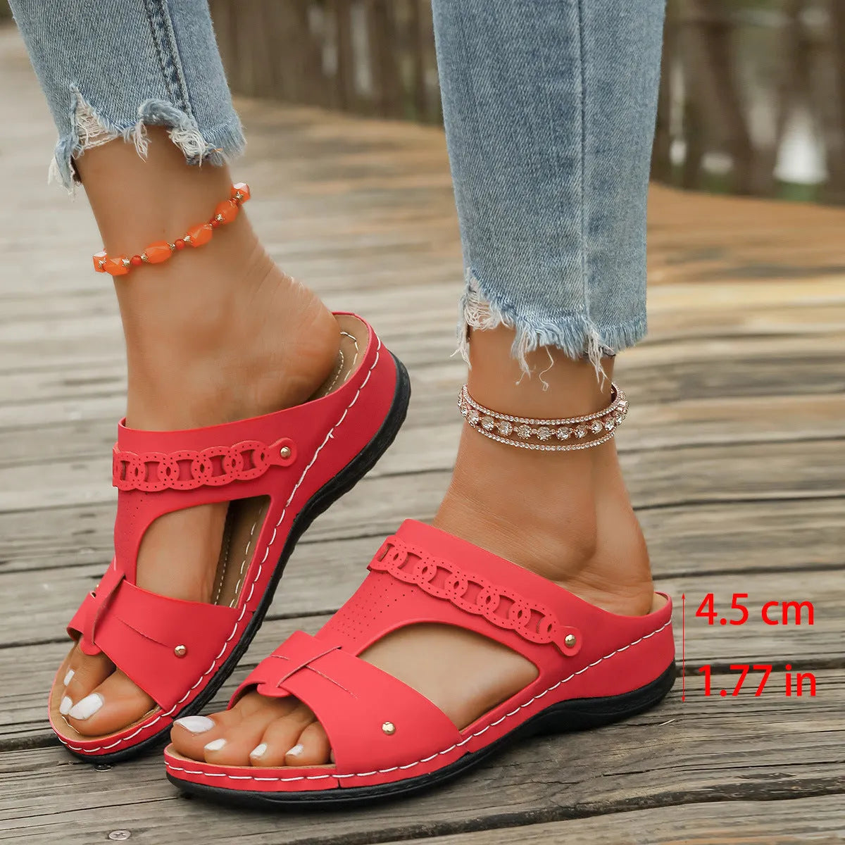 Roman style slope heel slippers with fish mouth toe in multiple colours on a rubber sole.