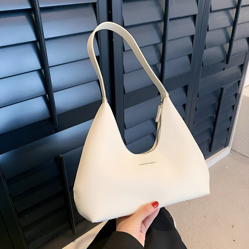 PU leather retro shoulder handbag in pillow design with single strap and internal organisation pockets