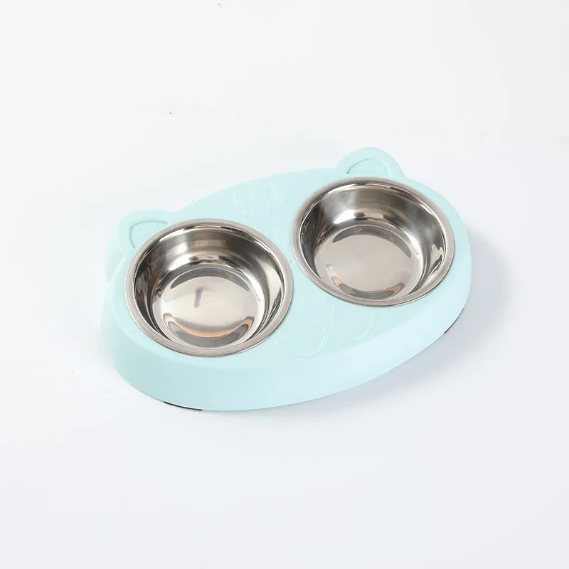 Blue plastic double bowl pet feeder tray for cats and small dogs on a floor.