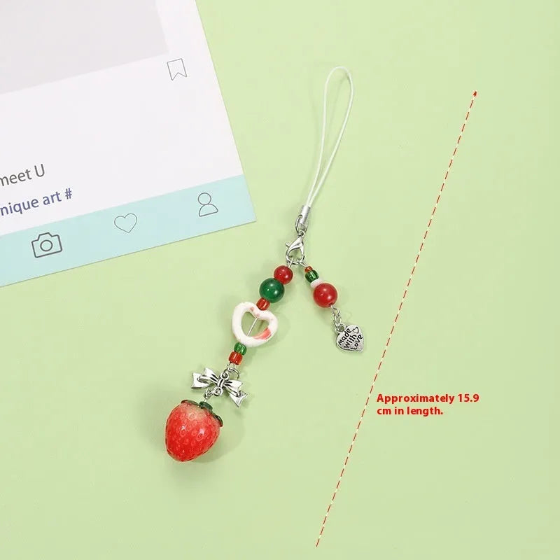 Cute fruit design plastic phone charm keychain on a white or silver rope.