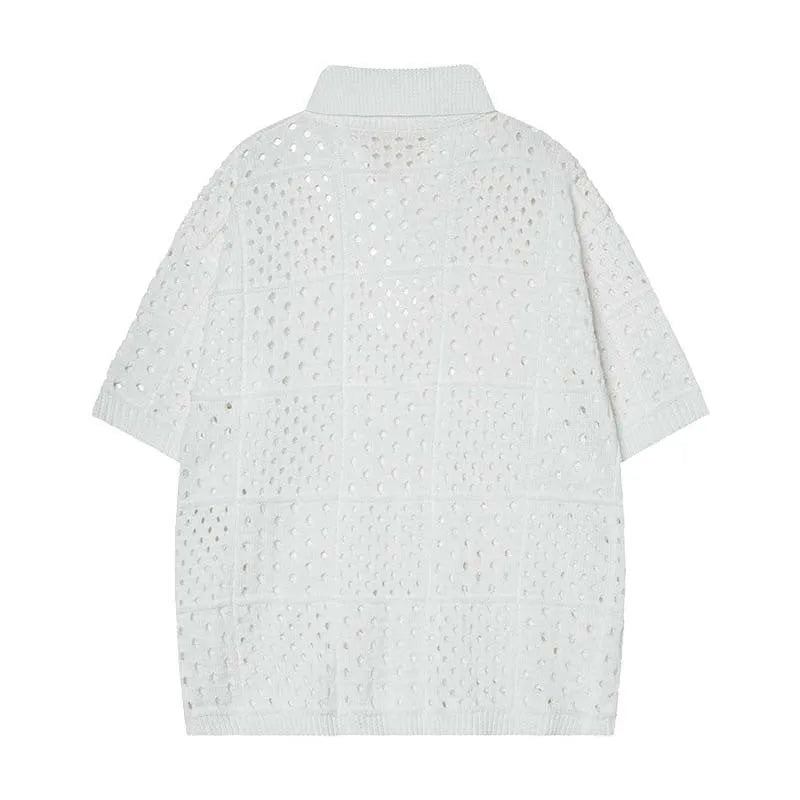 Man's black short-sleeved polo shirt with a hollow-knit texture and a loose, cardigan-style fit.