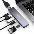 USB-C multiport adapter with Thunderbolt 3, HDMI, SD card slots, and USB ports in aluminium alloy case