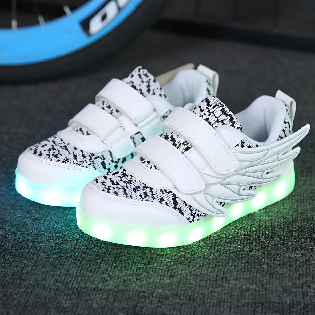 Children's plum red and white LED light up sneakers showing USB charging port and hidden mode switch.