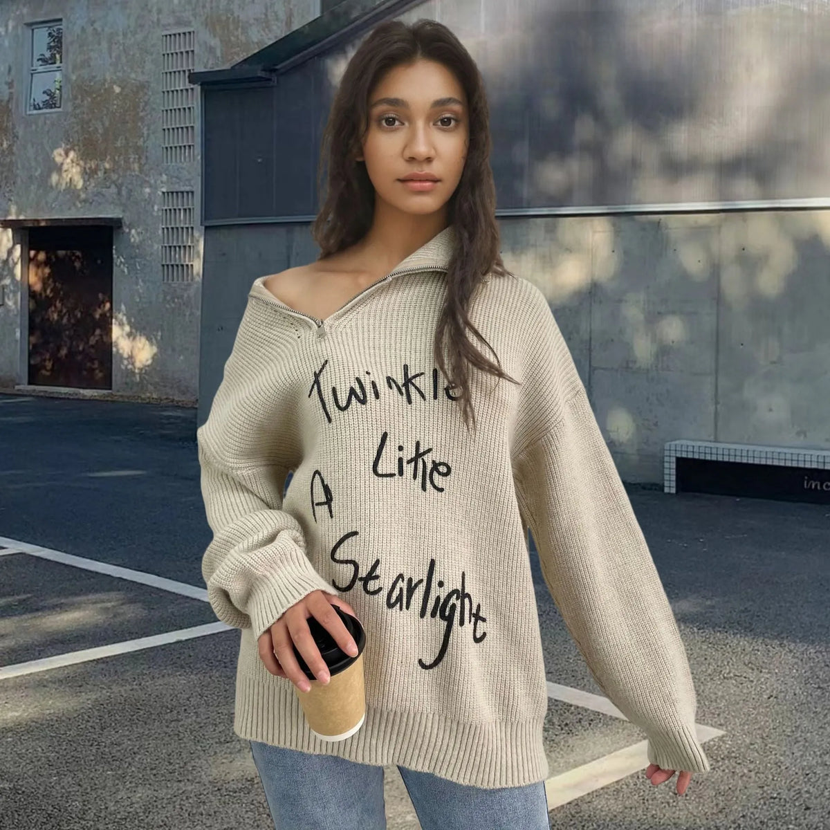 Woman wearing a light khaki alpaca wool pullover sweater with an oblique zipper and retro turtleneck.
