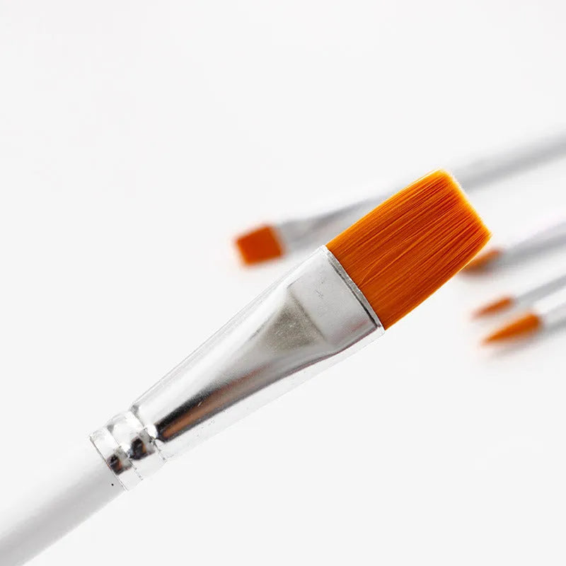 Set of six wood-handled artist paint brushes with aluminium ferrules on a white background.