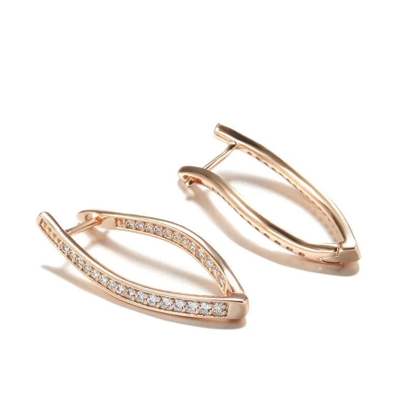 A pair of geometric drop earrings with a clear zircon stone and copper posts, colour H0493.