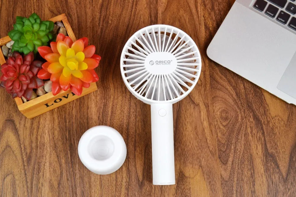 White ORICO FH1 USB rechargeable portable fan with fine line details on desktop