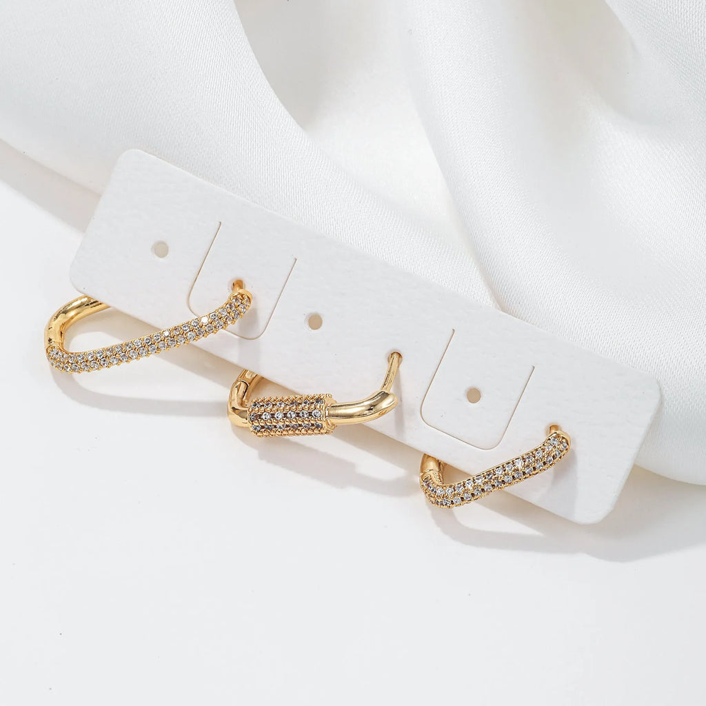 Set of three geometric ear clips with zircon inlay on copper in gold or white colours