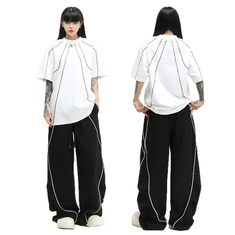 Black pleated wide-leg hip hop sports trousers with a stripe pattern on a mannequin