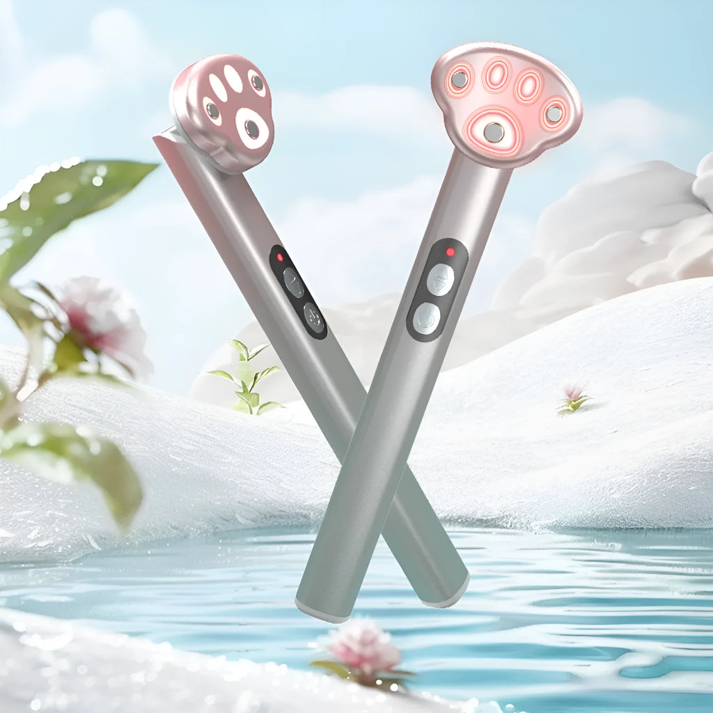 Cat's paw shaped micro-current eye massager in gradient pink with charging cable