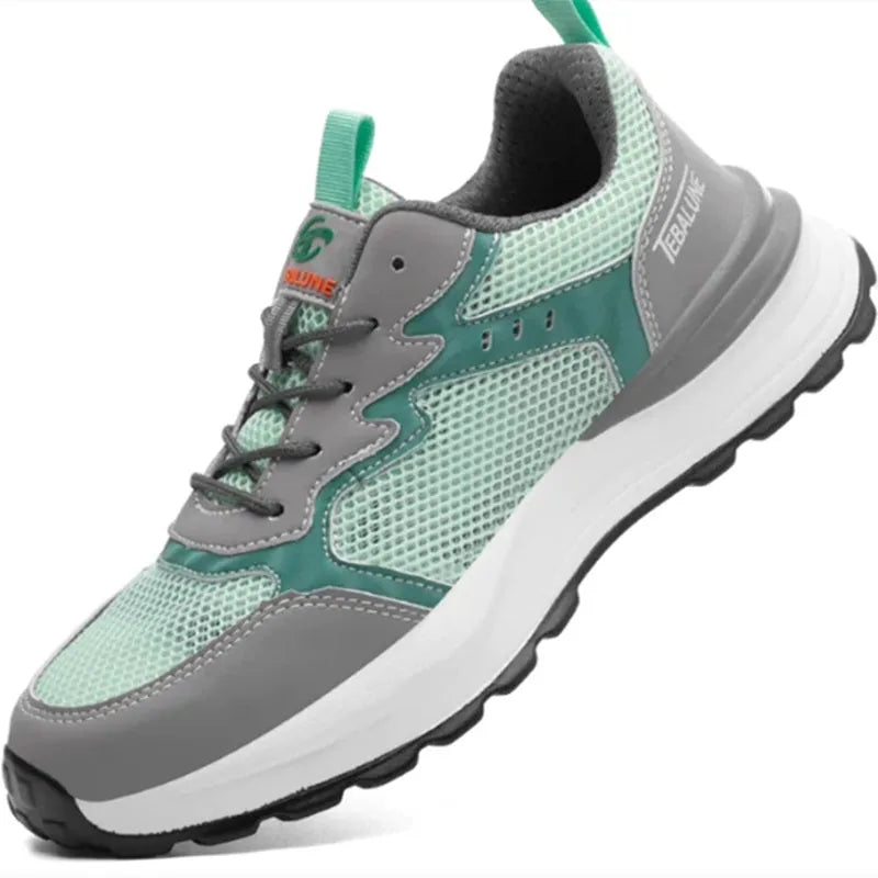 Green low top work shoes with mesh panels and plastic steel toe cap
