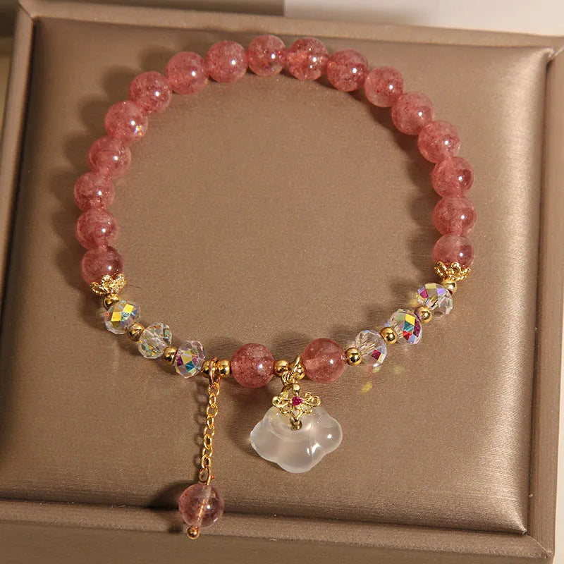 Women's crystal bracelet with strawberry quartz beads and white agate auspicious clouds design