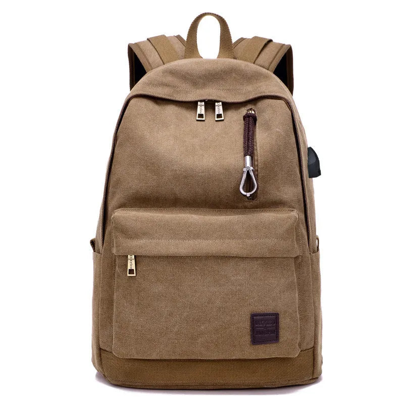 Canvas USB charging backpack in grey colour showing front pockets and shoulder straps