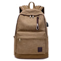 Canvas USB charging backpack in grey colour showing front pockets and shoulder straps