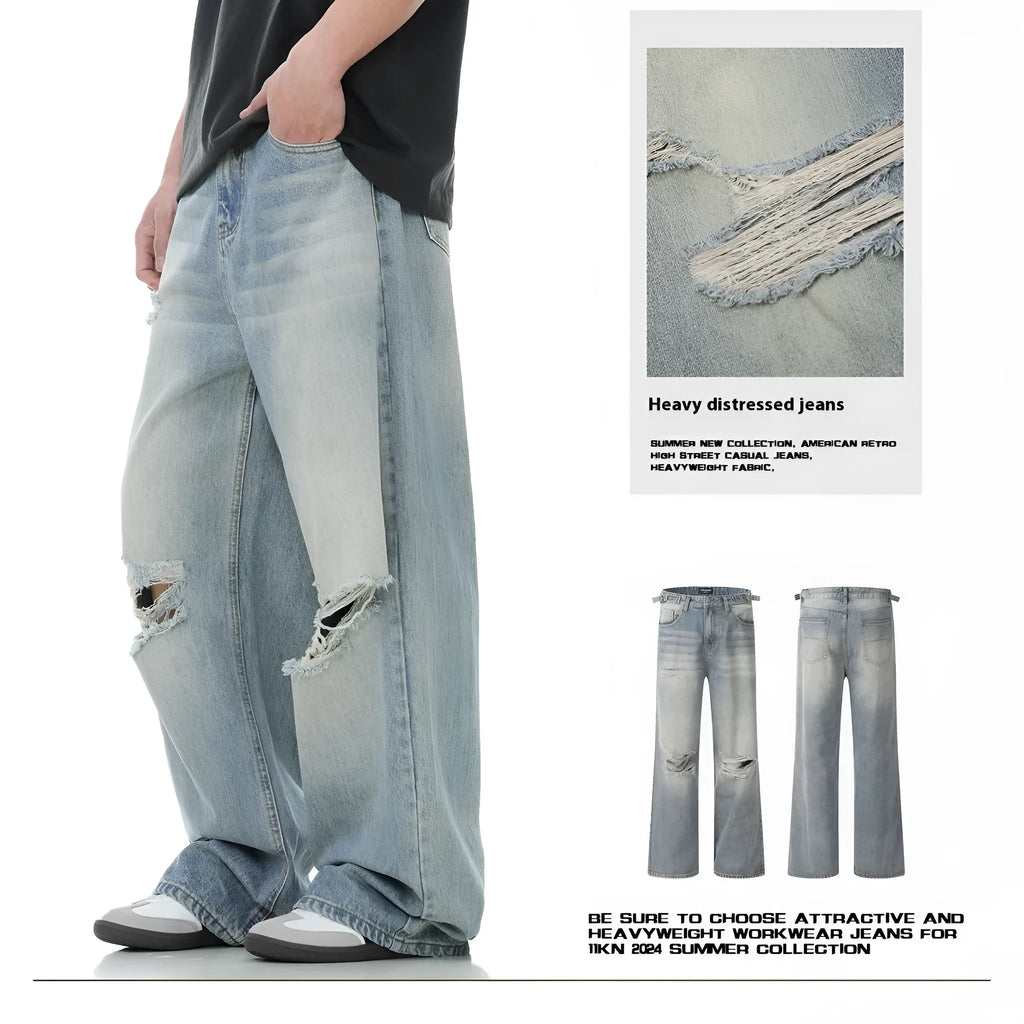 Man wearing blue retro-style straight-leg jeans with a ripped, distressed finish on the legs.