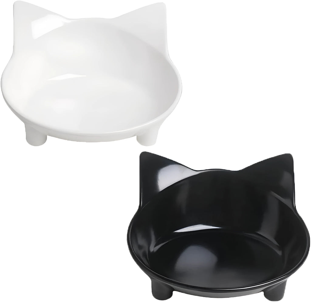 Four shallow black melamine pet bowls with non-slip rubber bases on a table.